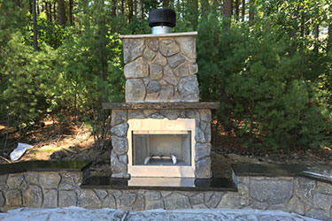 medium sized natural wood burning outdoor fireplace in Madison Wisconsin