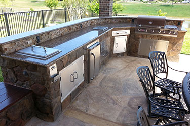 Outdoor Kitchen with Bar and Grill for backyards in Madison Wisconsin