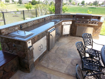 Outdoor kitchin with grill and fridge in Madison WI